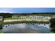 Venetian Bay community signage reflected in a peaceful lake at 2811 S Asciano Ct, New Smyrna Beach, FL 32168