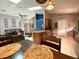 Bright, open-concept living space featuring modern kitchen and dining areas at 2953 Autumn Run Pl, Orlando, FL 32822