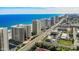 Aerial view of beachfront condo buildings, a coastal road, and panoramic ocean views at 2967 S Atlantic Ave # 1404, Daytona Beach, FL 32118