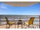 Balcony with chairs overlooking the ocean and beach at 2967 S Atlantic Ave # 1404, Daytona Beach, FL 32118
