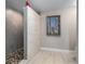 Contemporary bathroom featuring a mosaic tile floor shower and wood-look vinyl floors at 2967 S Atlantic Ave # 1404, Daytona Beach, FL 32118