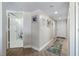 Bright hallway featuring wood flooring, decorative mirrors and direct access to the bathroom at 2967 S Atlantic Ave # 1404, Daytona Beach, FL 32118
