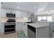 Modern kitchen with stainless steel appliances and sleek countertops, designed for efficiency at 2967 S Atlantic Ave # 1404, Daytona Beach, FL 32118