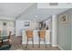 Chic kitchen bar area with stylish counter seating and a seamless transition to dining at 2967 S Atlantic Ave # 1404, Daytona Beach, FL 32118