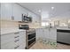Contemporary kitchen with stainless steel appliances, sleek cabinets, and an open design at 2967 S Atlantic Ave # 1404, Daytona Beach, FL 32118