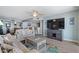 Open-concept living room with a view into the kitchen and dining area at 2967 S Atlantic Ave # 1404, Daytona Beach, FL 32118