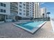 Community pool with lounge chairs, exterior deck and beachfront view at 2967 S Atlantic Ave # 1404, Daytona Beach, FL 32118