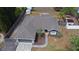 Aerial view of a fenced property featuring a well-maintained lawn, backyard shed, and mature trees at 3025 Bonkirk Dr, Deltona, FL 32738