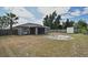 An expansive backyard featuring a screened patio and storage shed, perfect for outdoor activities at 3025 Bonkirk Dr, Deltona, FL 32738