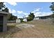 Large backyard featuring a storage shed and a partially fenced yard, perfect for outdoor activities at 3025 Bonkirk Dr, Deltona, FL 32738