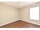 Well-lit room with wood floors and neutral paint featuring natural light from the window at 3025 Bonkirk Dr, Deltona, FL 32738