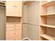 Walk-in closet with custom shelving, drawers, and ample storage space; perfect for organization at 3025 Bonkirk Dr, Deltona, FL 32738