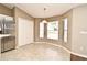 Sunlit dining nook features tile floors, a large closet, three windows, and a pendant light at 3025 Bonkirk Dr, Deltona, FL 32738