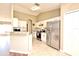 Bright open kitchen featuring white cabinetry, granite countertops, stainless appliances, and a breakfast bar at 3025 Bonkirk Dr, Deltona, FL 32738