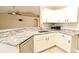 Kitchen features granite counters, stainless steel appliances, tile backsplash, and bright white cabinetry at 3025 Bonkirk Dr, Deltona, FL 32738