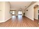 Spacious living room showcasing wood-look floors, neutral walls, and vaulted ceilings at 3025 Bonkirk Dr, Deltona, FL 32738