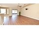 Spacious living room showcasing wood-look floors, neutral walls, vaulted ceilings, and sliding glass door at 3025 Bonkirk Dr, Deltona, FL 32738