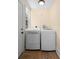 Functional laundry room with a washing machine and dryer, featuring a neutral color palette at 333 N Kentucky Ave, Deland, FL 32724