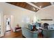 Charming living room with a wood-paneled ceiling, a fireplace, and cozy seating arrangement at 333 N Kentucky Ave, Deland, FL 32724