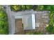 Aerial view of a charming home featuring a patio, long driveway, and private backyard at 333 Redwood Ave, Orange City, FL 32763