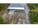 Aerial view of home's backyard with screened lanai and view of rear neighbor's screened lanai at 333 Redwood Ave, Orange City, FL 32763