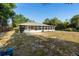 Wide angle of the rear screened-in patio and large backyard at 333 Redwood Ave, Orange City, FL 32763