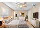 Serene bedroom features a ceiling fan, neutral decor, and a walk-in closet at 333 Redwood Ave, Orange City, FL 32763
