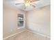 Bright bedroom with a ceiling fan and a window, offering a comfortable and serene atmosphere at 333 Redwood Ave, Orange City, FL 32763
