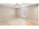 Bright bedroom with a ceiling fan and a window, offering a comfortable and serene atmosphere at 333 Redwood Ave, Orange City, FL 32763