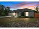 Charming single-story home with gray exterior, manicured shrubs, and a cozy two-car garage at 333 Redwood Ave, Orange City, FL 32763