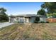 Charming single-story home with a well-maintained front yard and attached garage at 333 Redwood Ave, Orange City, FL 32763