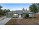 Charming single-story home with a well-maintained front yard and attached garage at 333 Redwood Ave, Orange City, FL 32763