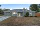 Charming single-story home with a well-maintained front yard and attached garage at 333 Redwood Ave, Orange City, FL 32763