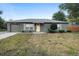 Charming single-story home with a well-maintained front yard and attached garage at 333 Redwood Ave, Orange City, FL 32763