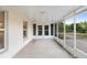 The screened-in patio offers a perfect spot to relax and enjoy the view of the backyard and serene atmosphere at 333 Redwood Ave, Orange City, FL 32763