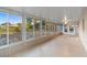 Enclosed patio with multiple windows offering views of the backyard and allowing ample natural light at 333 Redwood Ave, Orange City, FL 32763