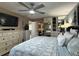Main bedroom with a serene color scheme, mirrored closets, and ample storage solutions at 400 Taylorville St, Deltona, FL 32725