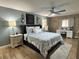 Comfortable bedroom with a decorative headboard, soft lighting, and a dedicated desk area at 400 Taylorville St, Deltona, FL 32725