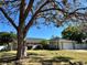 Charming single-story home with a well-manicured lawn and mature shade tree in front yard at 400 Taylorville St, Deltona, FL 32725