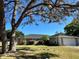 Charming single-story home with a well-manicured lawn and mature shade tree in front yard at 400 Taylorville St, Deltona, FL 32725