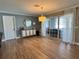 Bright living space with tiled floors, natural light, decorative cabinet and sliding doors to the outdoors at 400 Taylorville St, Deltona, FL 32725