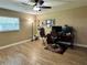 Home office space with a window, wood-look tile flooring, and a functional desk setup at 400 Taylorville St, Deltona, FL 32725