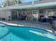Inviting screened-in outdoor area featuring a sparkling pool, patio, and lounging area at 400 Taylorville St, Deltona, FL 32725