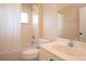 Clean bathroom featuring a shower with a curtain, toilet, and a vanity with a large sink at 41 Ormond Green Blvd, Ormond Beach, FL 32174