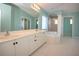 Light and bright bathroom with double vanity, large mirror, walk-in shower, and jacuzzi tub at 41 Ormond Green Blvd, Ormond Beach, FL 32174