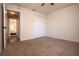 Neutral bedroom featuring neutral carpet and a closet, with a view into another carpeted room at 41 Ormond Green Blvd, Ormond Beach, FL 32174