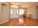 Bright entryway with hardwood floors, neutral walls, and a view of the front yard through a window at 41 Ormond Green Blvd, Ormond Beach, FL 32174