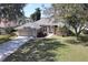 Beautiful one-story home with well-manicured lawn and landscaping, complemented by a two-car garage at 41 Ormond Green Blvd, Ormond Beach, FL 32174
