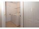 Convenient laundry room featuring a washer, dryer, and a doorway leading to another room in the house at 41 Ormond Green Blvd, Ormond Beach, FL 32174