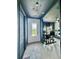 Stylish entryway leading to a home gym with modern lighting and ample space for equipment at 4133 Gilford Cir, Ormond Beach, FL 32174